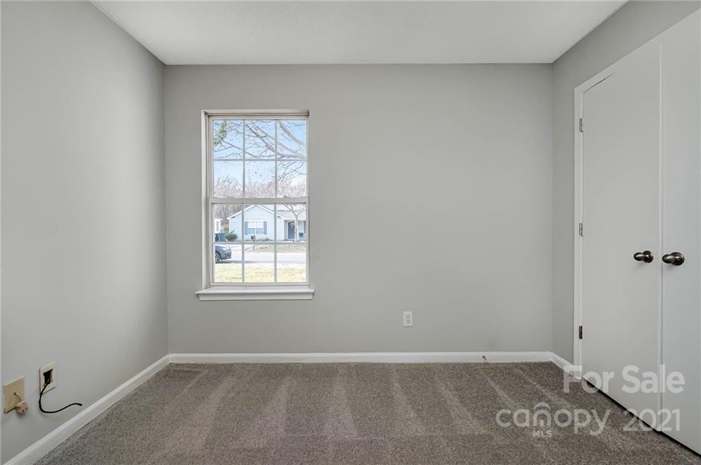2884 Rockingham Court Southwest Concord, NC 28025 - Photo 14 of 17 an empty room with windows