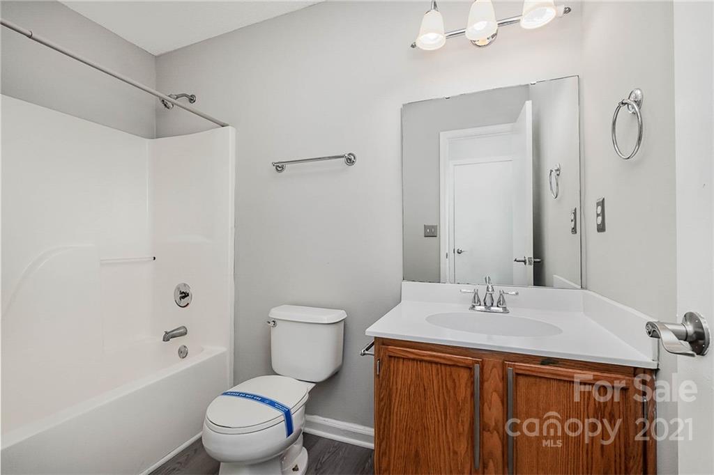 2884 Rockingham Court Southwest Concord, NC 28025 - Photo 16 of 17 a bathroom with a sink toilet and shower