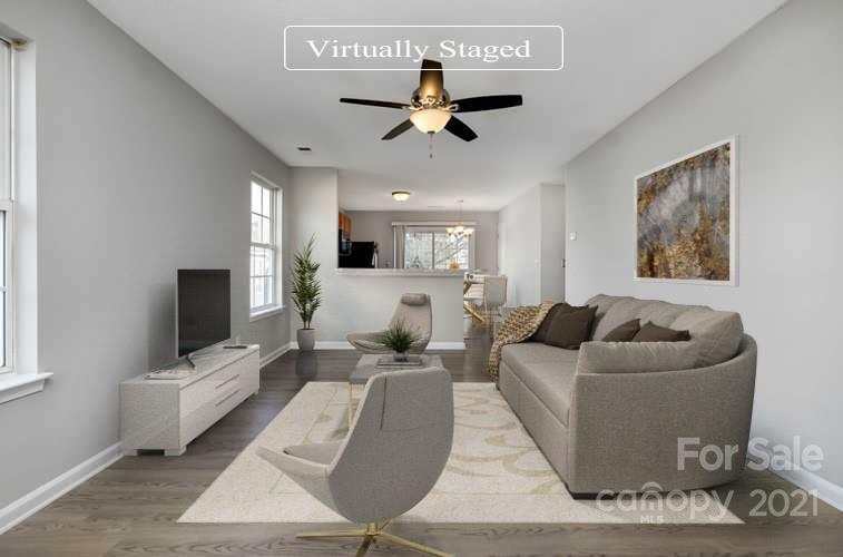 2884 Rockingham Court Southwest Concord, NC 28025 - Photo 2 of 17 a living room with furniture and a flat screen tv