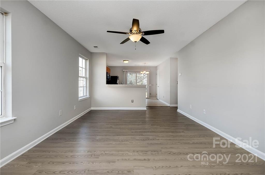 2884 Rockingham Court Southwest Concord, NC 28025 - Photo 5 of 17 a view of empty room with wooden floor and fan