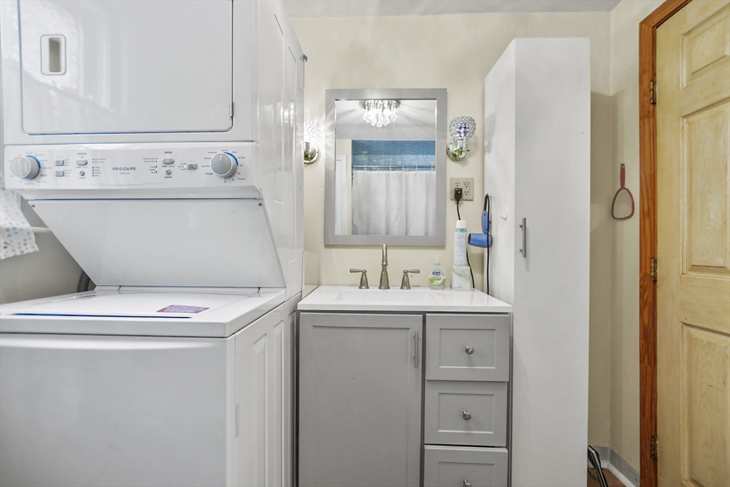 82 Cedar Street Everett, MA 02149 - Photo 16 of 41 a utility room with dryer and washer