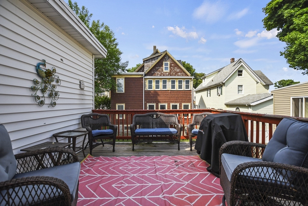 82 Cedar Street Everett, MA 02149 - Photo 21 of 41 a view of a patio with couches chairs and a potted plant