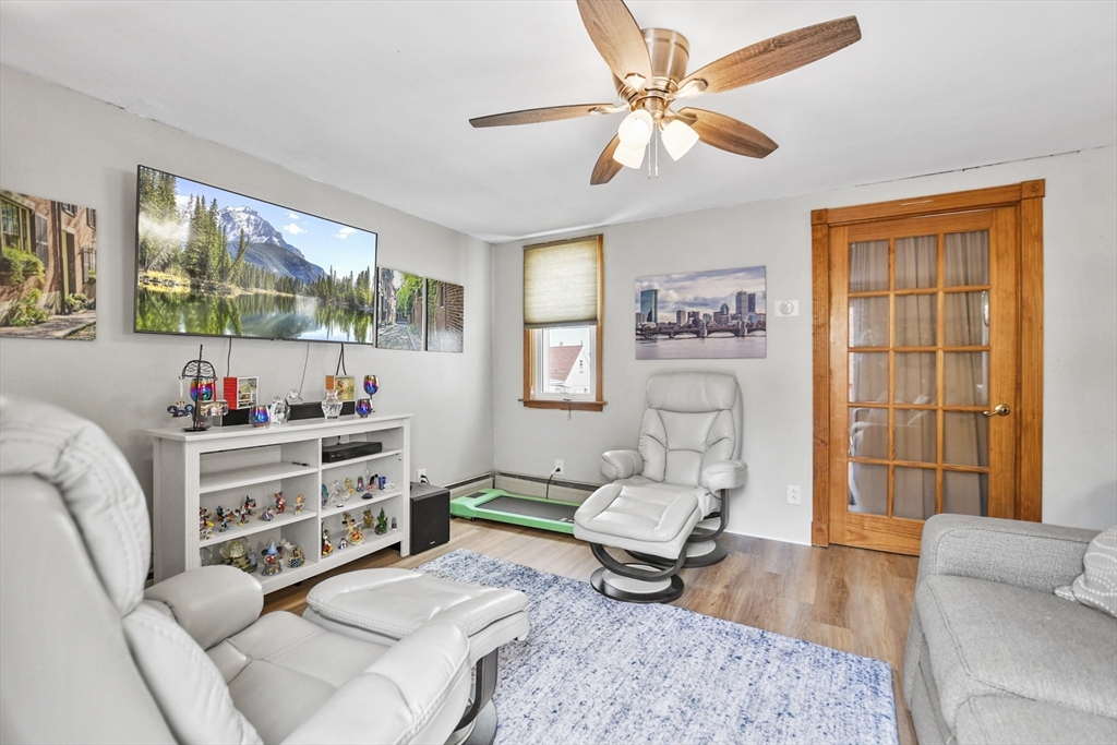 82 Cedar Street Everett, MA 02149 - Photo 23 of 41 a living room with furniture and a large window