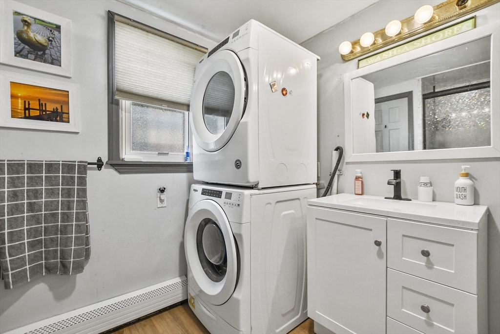 82 Cedar Street Everett, MA 02149 - Photo 30 of 41 a view of a bathroom with washing machine and washing machine