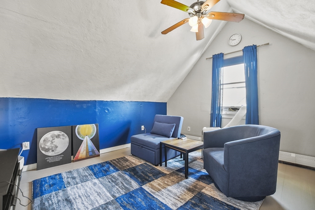 82 Cedar Street Everett, MA 02149 - Photo 33 of 41 a living room with furniture and a window