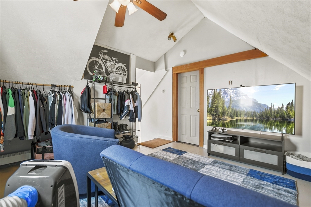 82 Cedar Street Everett, MA 02149 - Photo 34 of 41 a living room with furniture and a flat screen tv