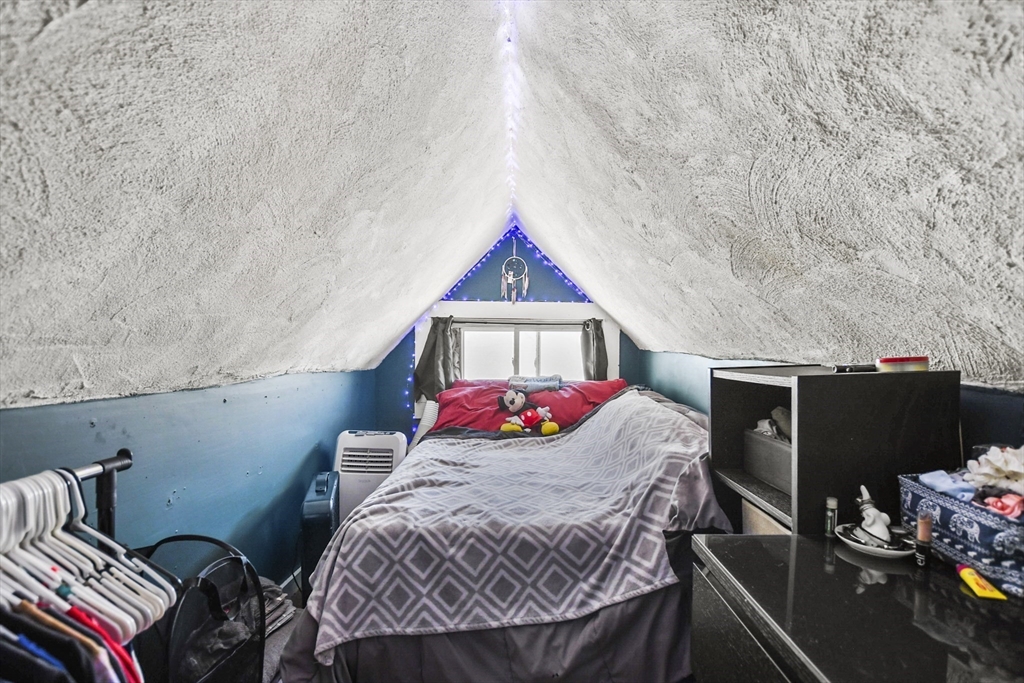 82 Cedar Street Everett, MA 02149 - Photo 37 of 41 a living room with furniture and a flat screen tv