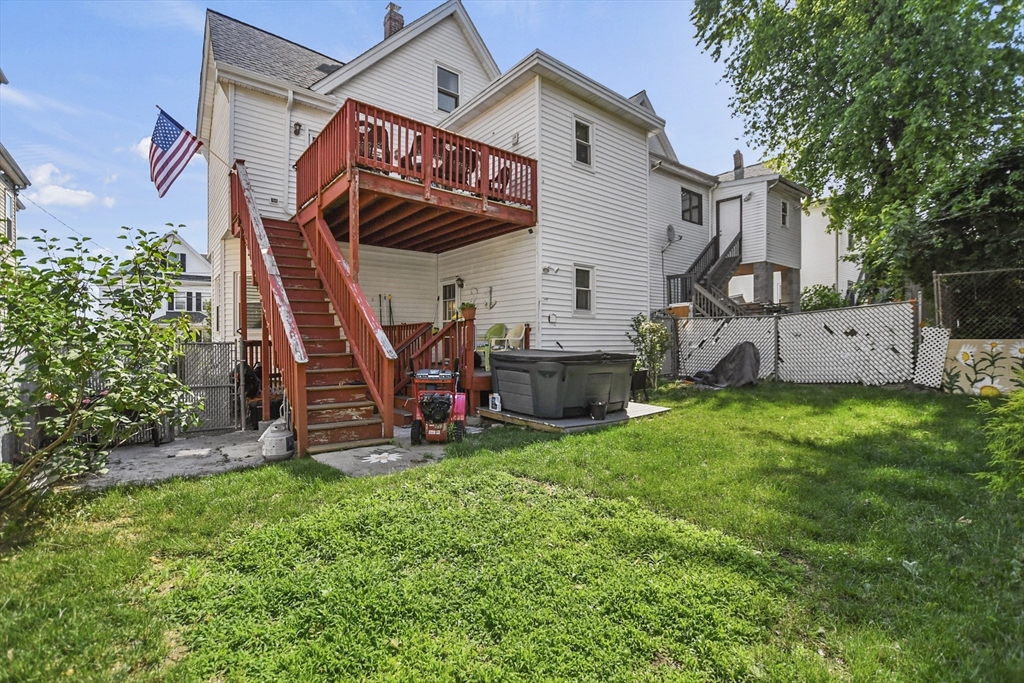 82 Cedar Street Everett, MA 02149 - Photo 40 of 41 a view of a house with a yard and furniture