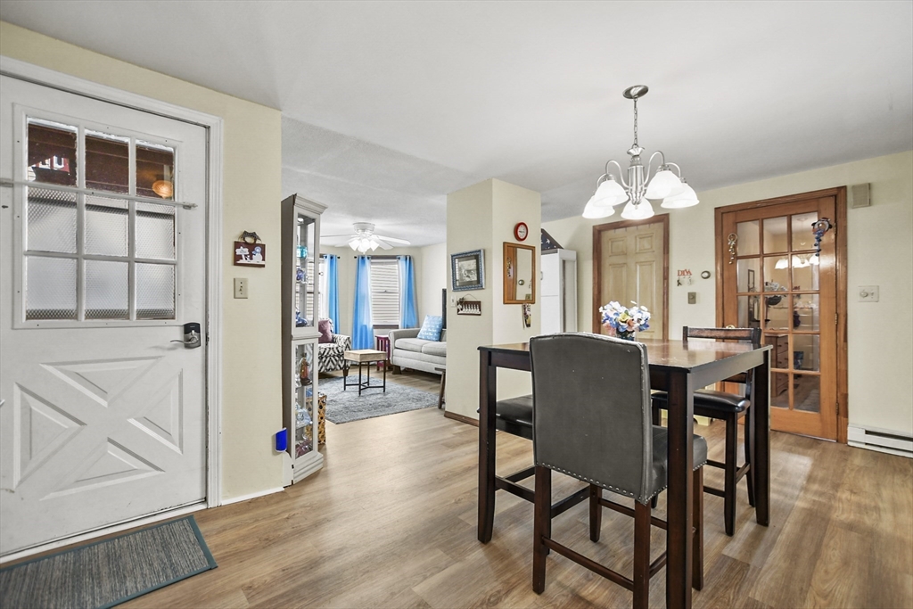 82 Cedar Street Everett, MA 02149 - Photo 7 of 41 a view of a dining room with furniture and wooden floor