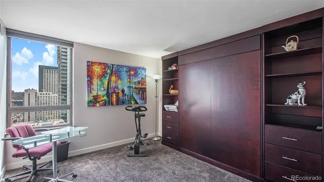 a view of a livingroom with furniture and windows