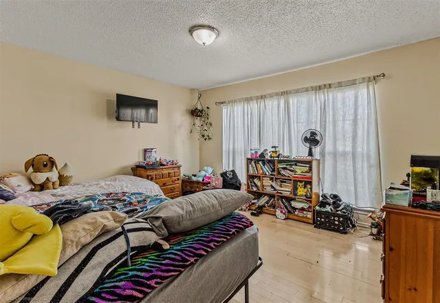 a bedroom with furniture and a bed