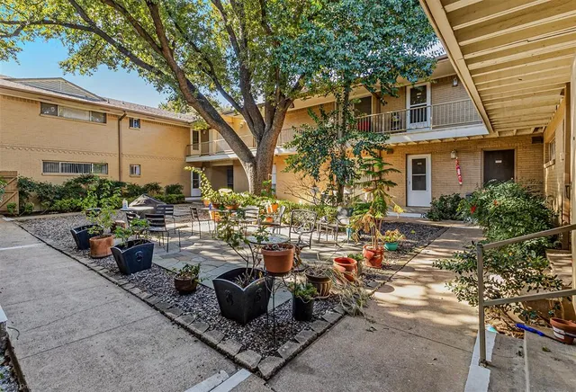 a view of a house with backyard porch and sitting area
