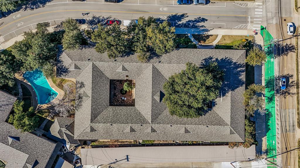 7910 Northaven Road, Unit B Dallas, TX 75230 - Photo 26 of 27 an aerial view of a house with a yard and large trees