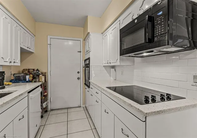 a kitchen with a stove and a microwave