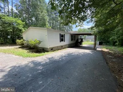 a view of a house with a yard and garage
