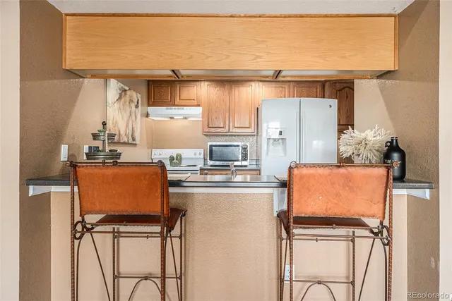 view of living room with furniture and large window