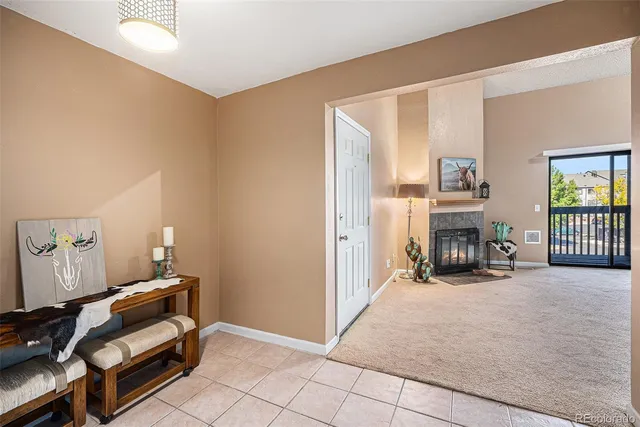 a view of a livingroom with entryway and furniture