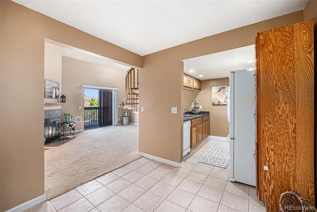 a view of a hallway with living room and dining room view