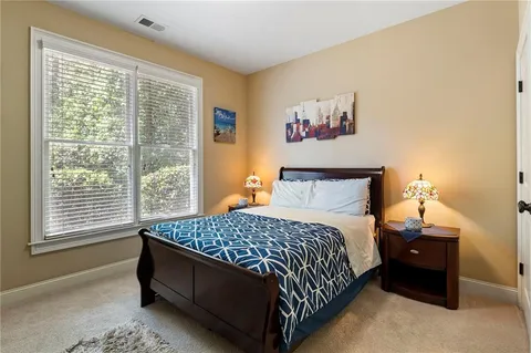 an empty room with windows and door