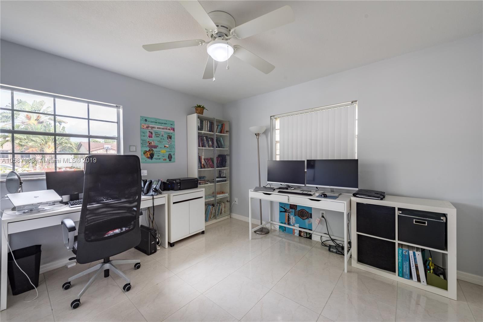 8912 Southwest 6th Street Boca Raton, FL 33433 - Photo 16 of 19 a view of a workspace with furniture and a window