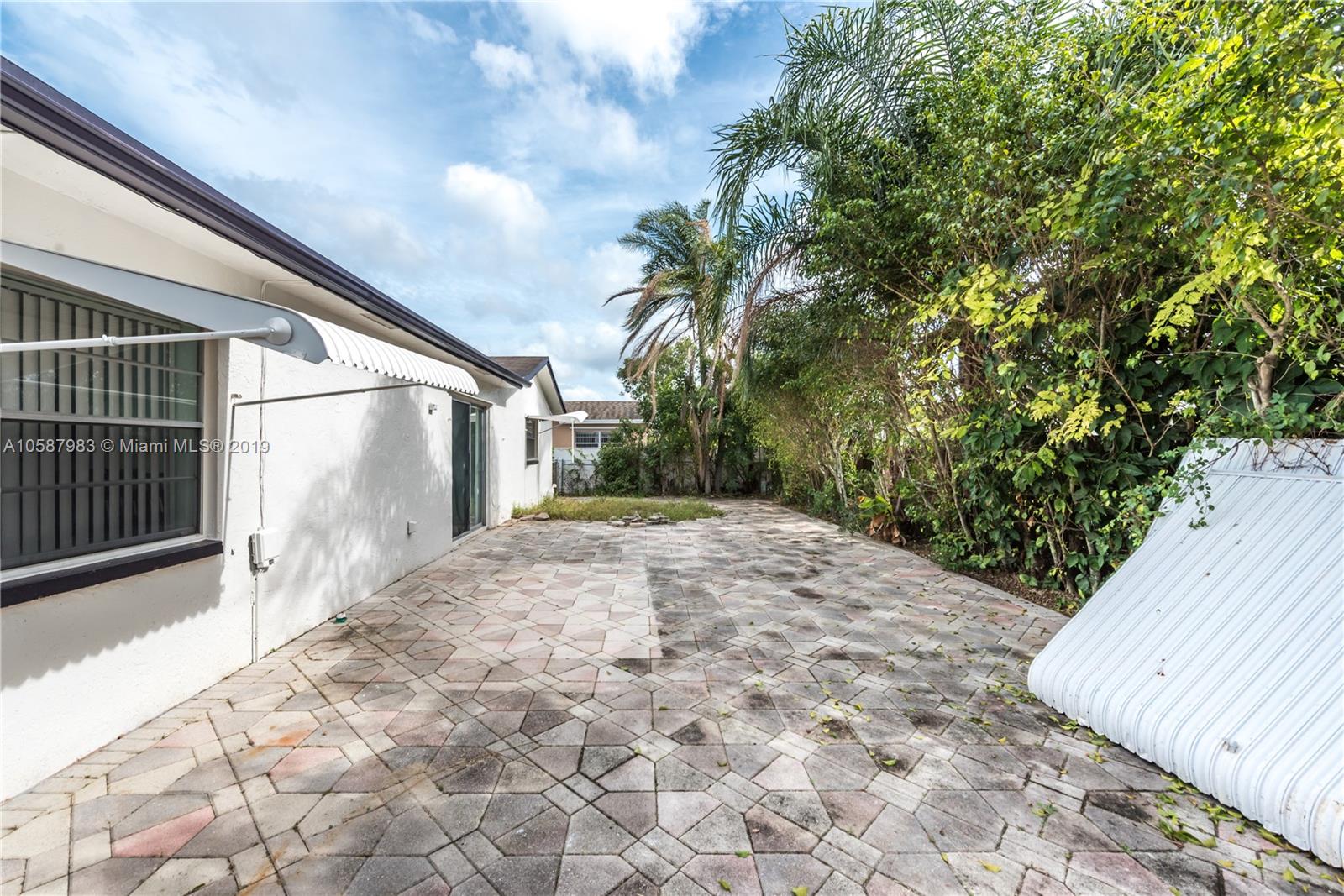 8912 Southwest 6th Street Boca Raton, FL 33433 - Photo 18 of 19 a view of a house with a yard