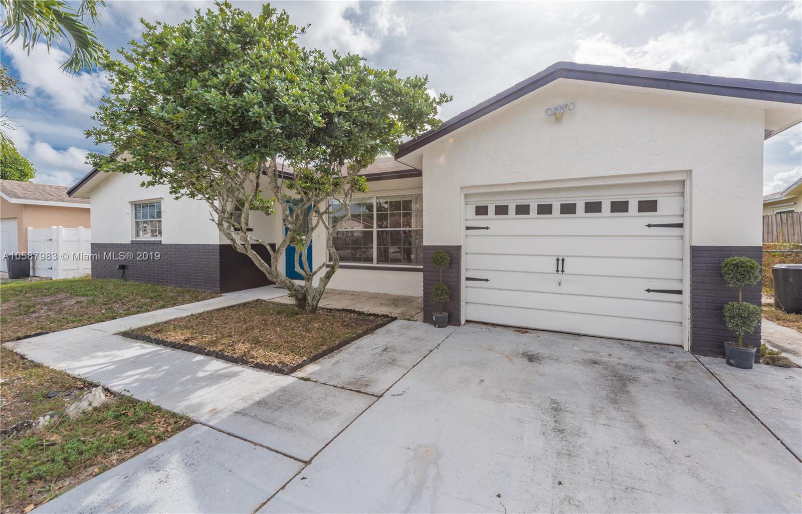 8912 Southwest 6th Street Boca Raton, FL 33433 - Photo 19 of 19 a view of a house with a yard