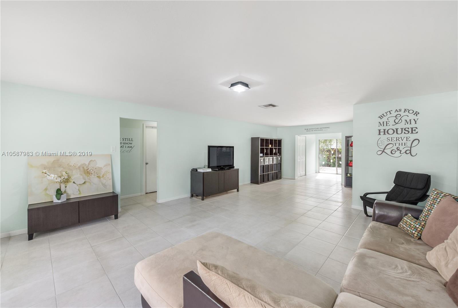8912 Southwest 6th Street Boca Raton, FL 33433 - Photo 7 of 19 a living room with furniture and a couch