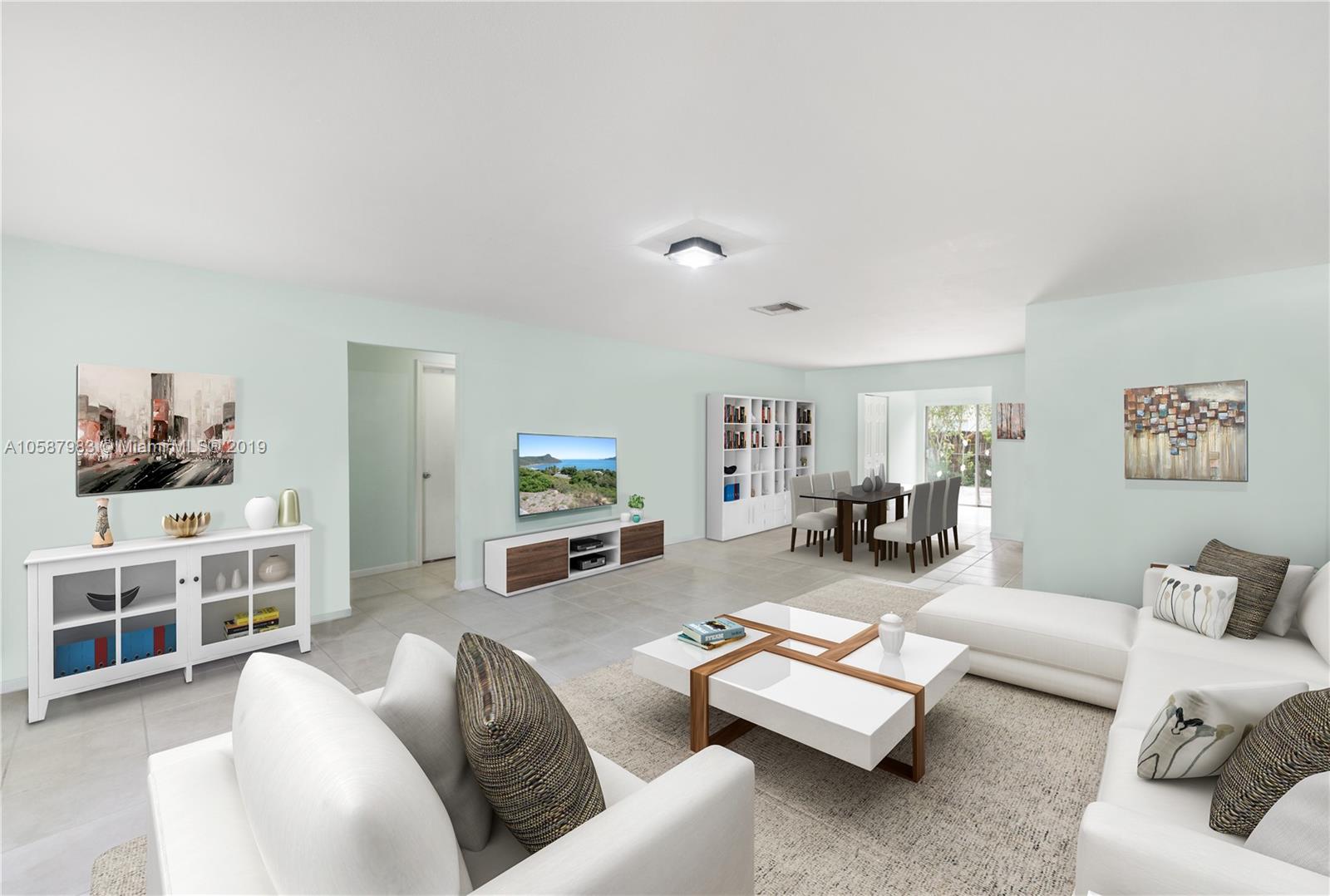8912 Southwest 6th Street Boca Raton, FL 33433 - Photo 8 of 19 a living room with furniture and a flat screen tv