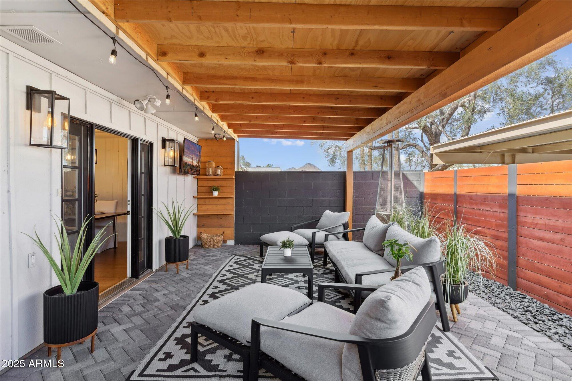 5020 North Granite Reef Road Scottsdale, AZ 85250 - Photo 1 of 24 a outdoor living space with furniture and a potted plant