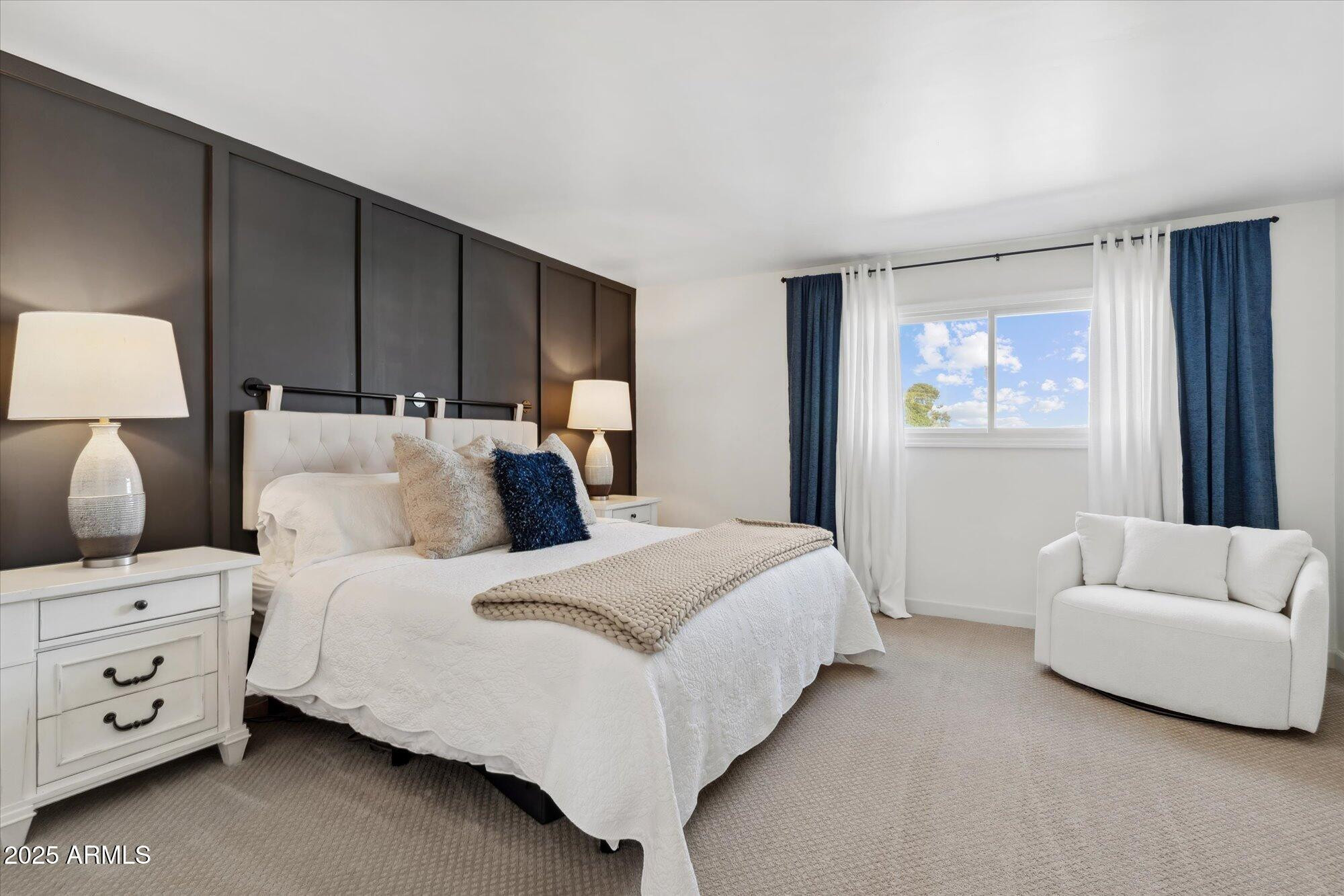 5020 North Granite Reef Road Scottsdale, AZ 85250 - Photo 12 of 24 a bedroom with a bed and a couch