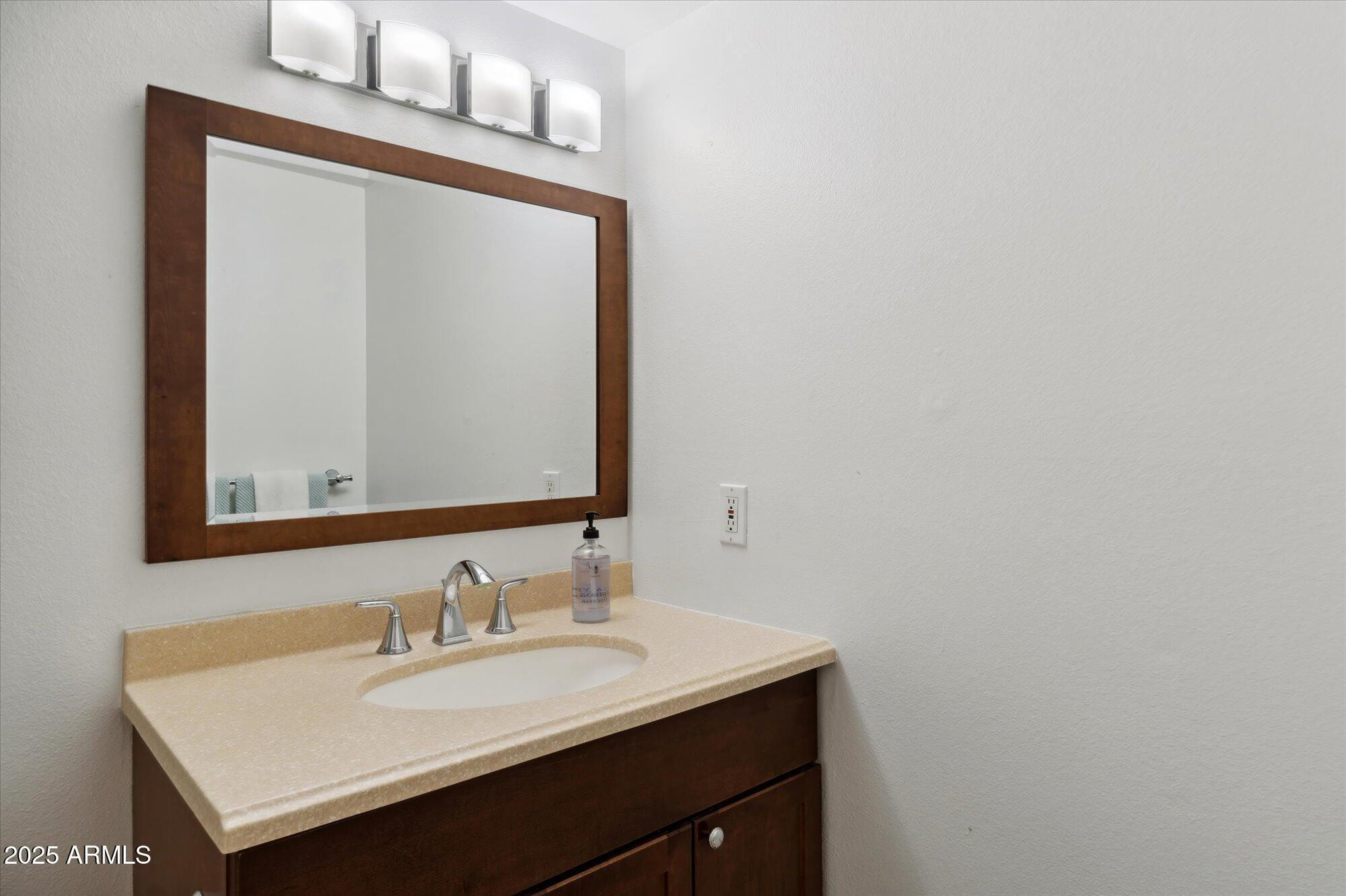 5020 North Granite Reef Road Scottsdale, AZ 85250 - Photo 15 of 24 a bathroom with a sink and a mirror