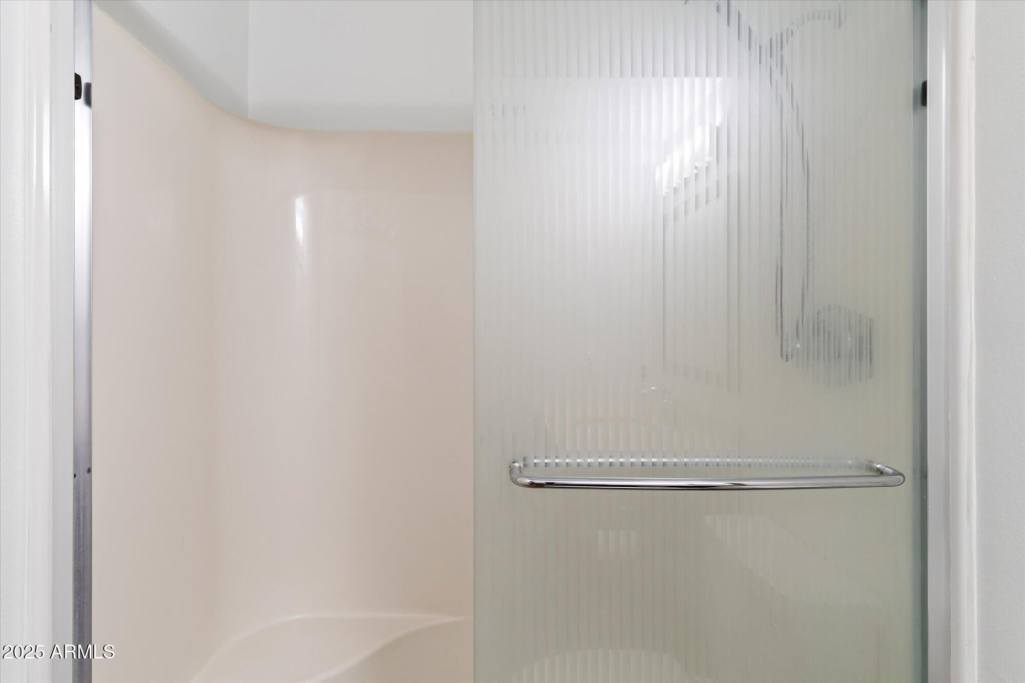 5020 North Granite Reef Road Scottsdale, AZ 85250 - Photo 16 of 24 a bathroom with a glass shower door