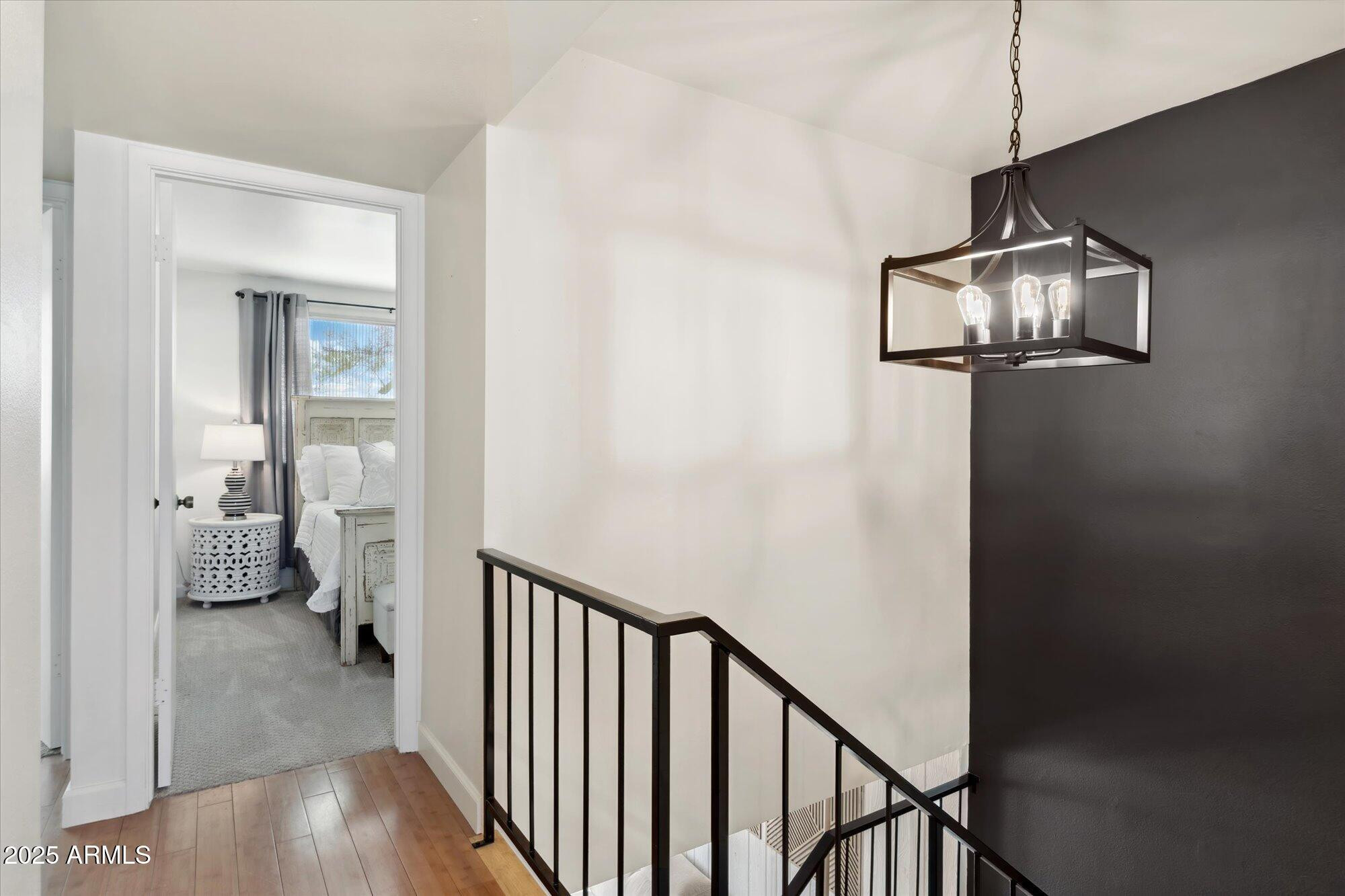 5020 North Granite Reef Road Scottsdale, AZ 85250 - Photo 17 of 24 a view of a hallway with a livingroom and a chandelier