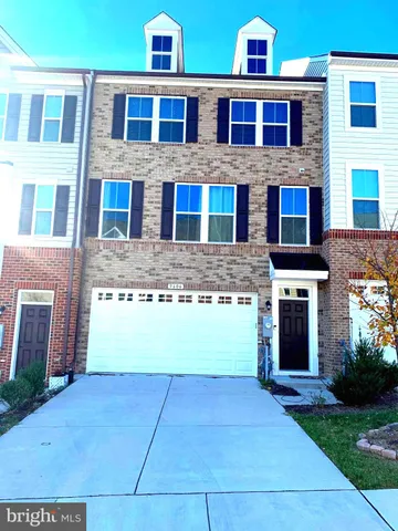 a front view of building with yard