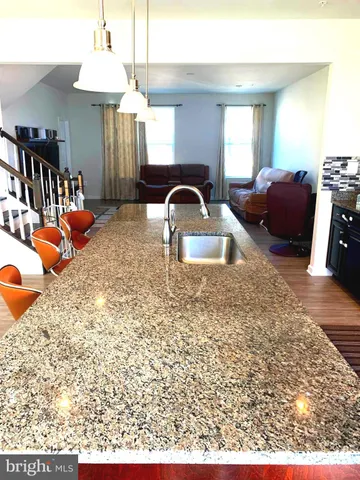 a dining room with a table and chairs