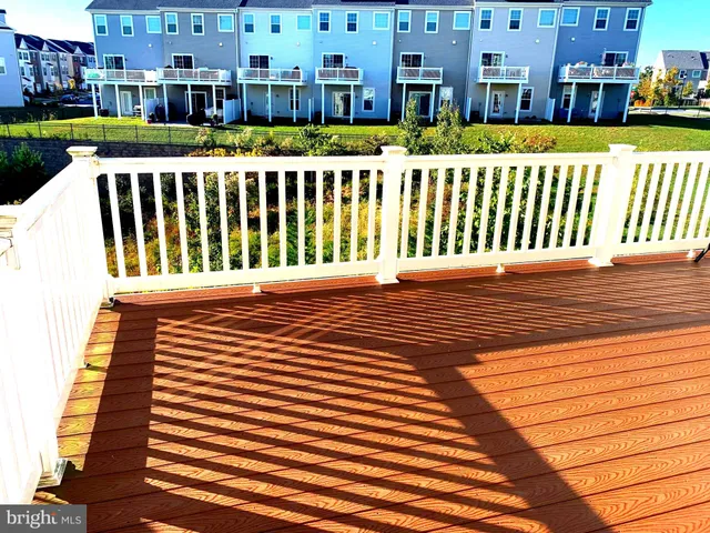 a bedroom with a bed and a mirror on the dresser