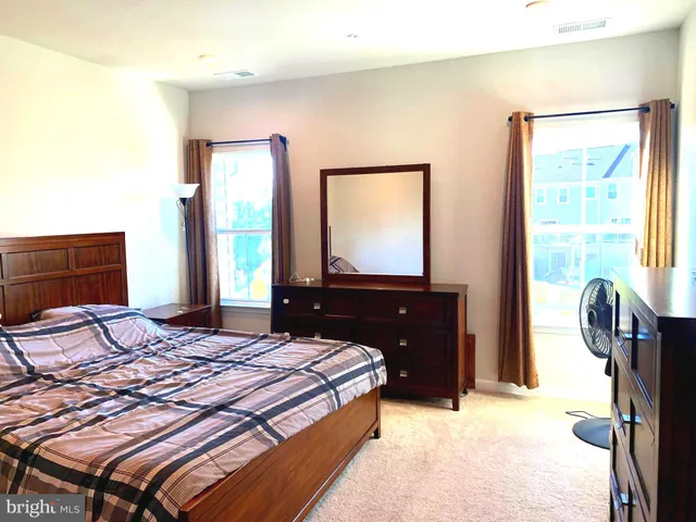 a bathroom with a double vanity sink a mirror and a