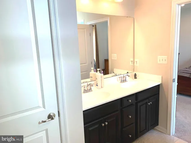 a bedroom with a bed and a shower