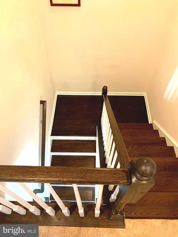 a view of a house with wooden fence