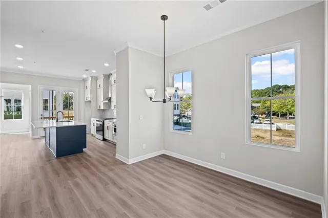 a view of kitchen and dining room with wooden floor