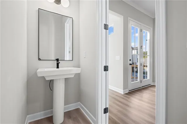 a bathroom with a sink and mirror