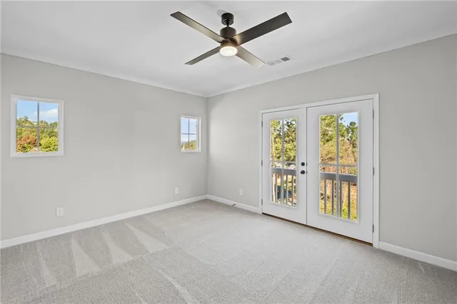 a view of an empty room with a window