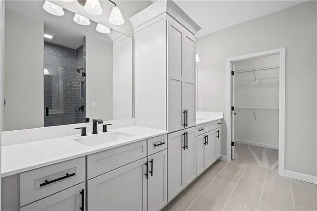a bathroom with double vanity sink and mirror