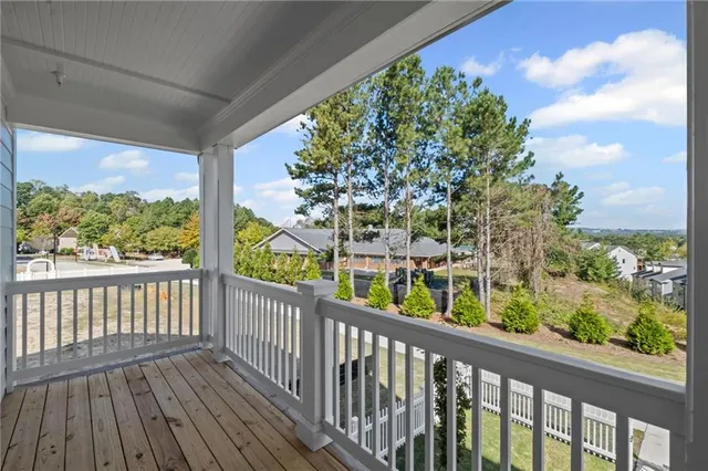 a view of a balcony with wooden floor