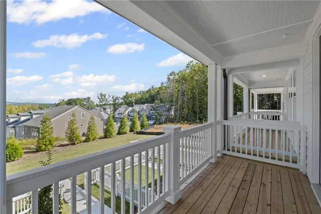 a view of a balcony with wooden floor