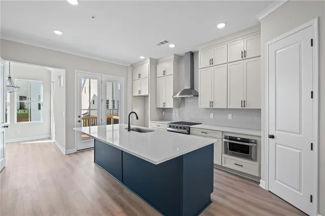 a kitchen with a sink stove and refrigerator