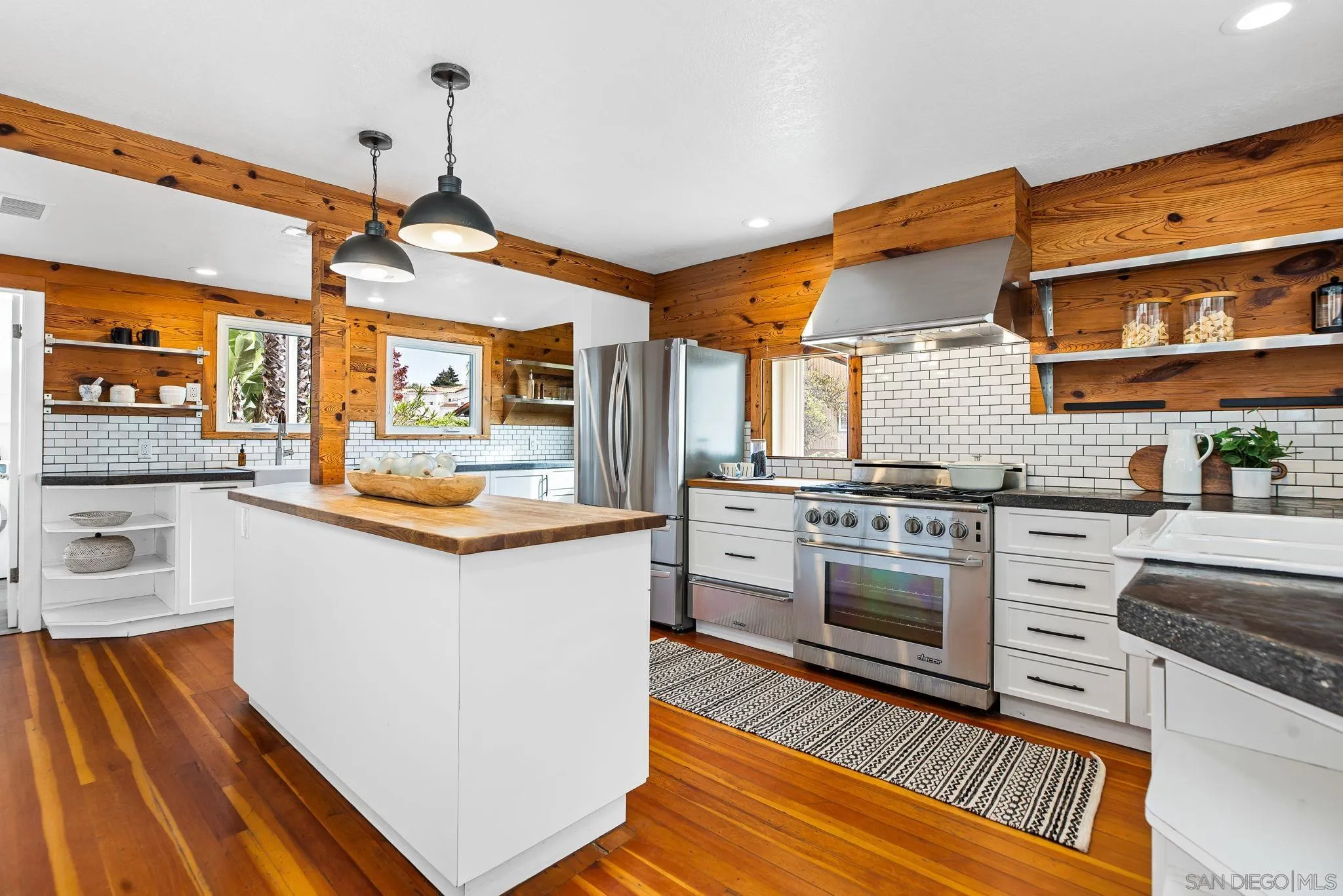 445 Sheffield Avenue Cardiff, CA 92007 - Photo 17 of 62 a kitchen with stainless steel appliances granite countertop a stove and a sink