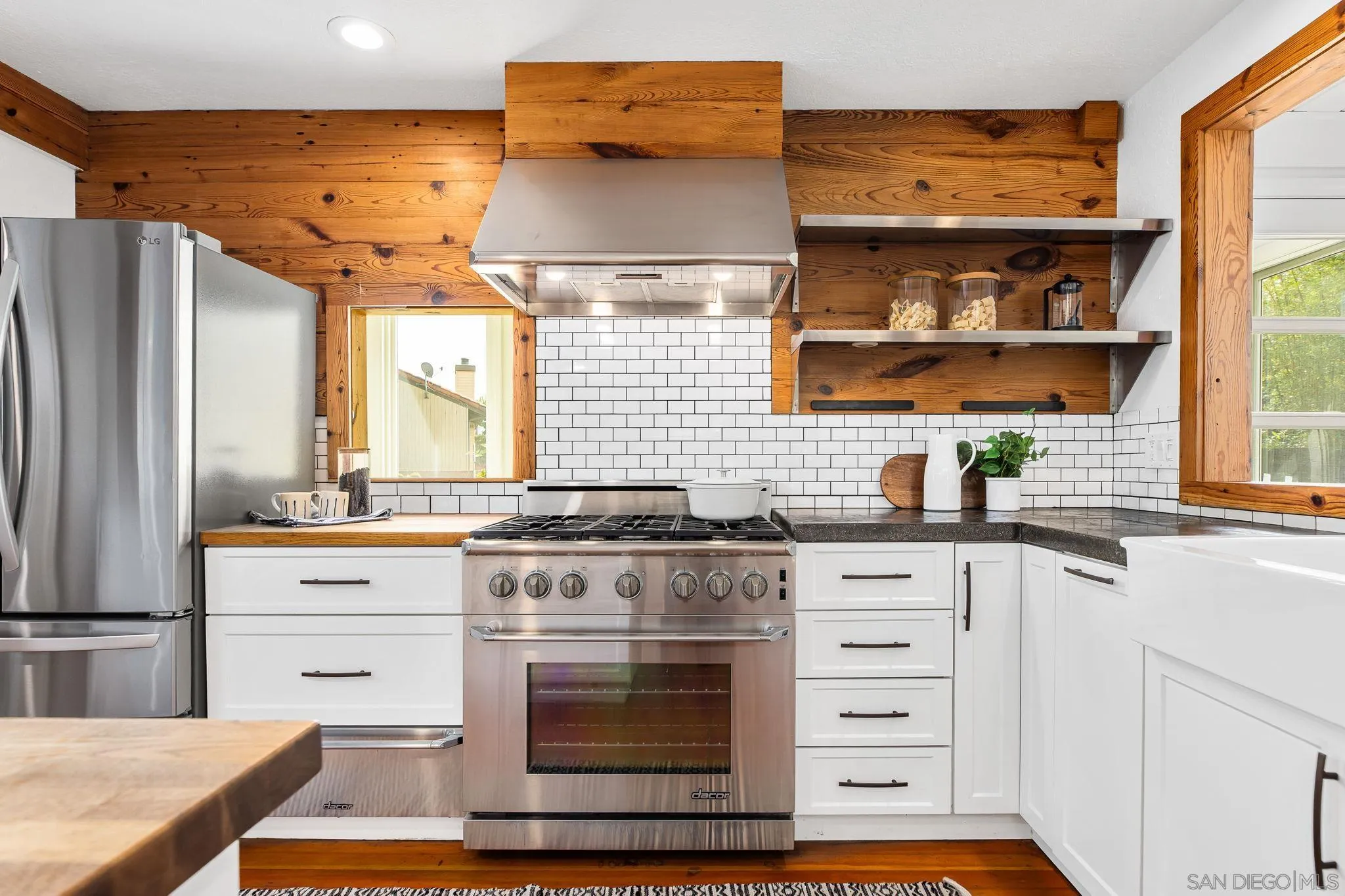 445 Sheffield Avenue Cardiff, CA 92007 - Photo 18 of 62 a kitchen with cabinets appliances and a window