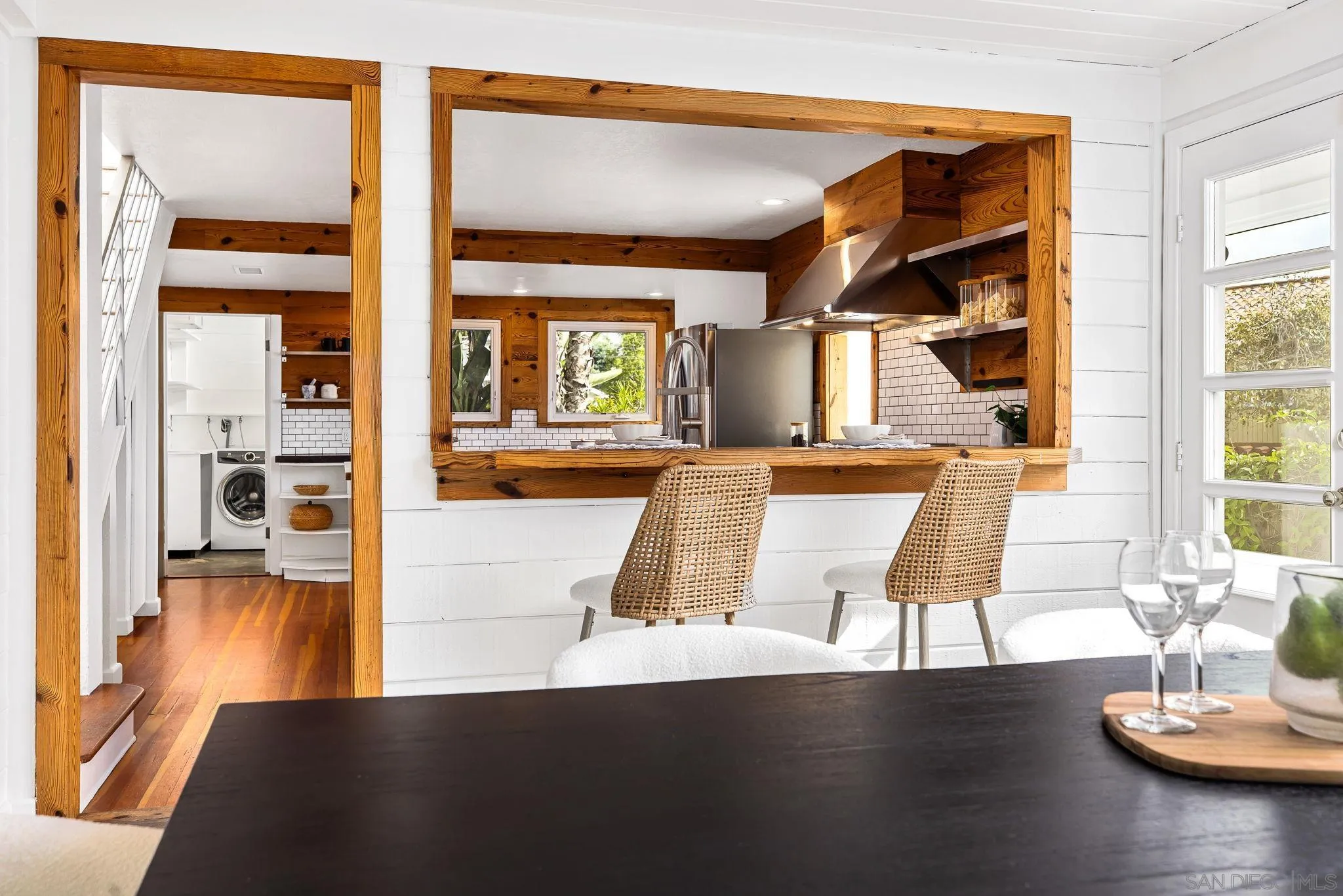 445 Sheffield Avenue Cardiff, CA 92007 - Photo 24 of 62 a living room with kitchen view and wooden floor
