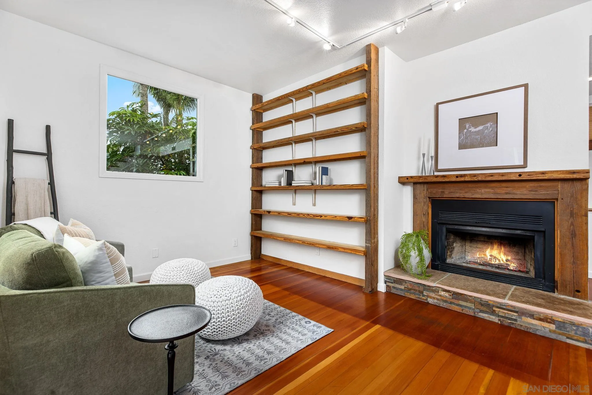 445 Sheffield Avenue Cardiff, CA 92007 - Photo 29 of 62 a living room with furniture and a fireplace